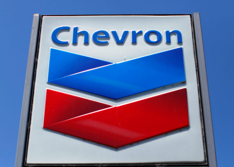 FILE PHOTO: A Chevron gas station sign is seen in Del Mar, California, April 25, 2013. Chevron will report earnings on April 26. REUTERS/Mike Blake/File Photo