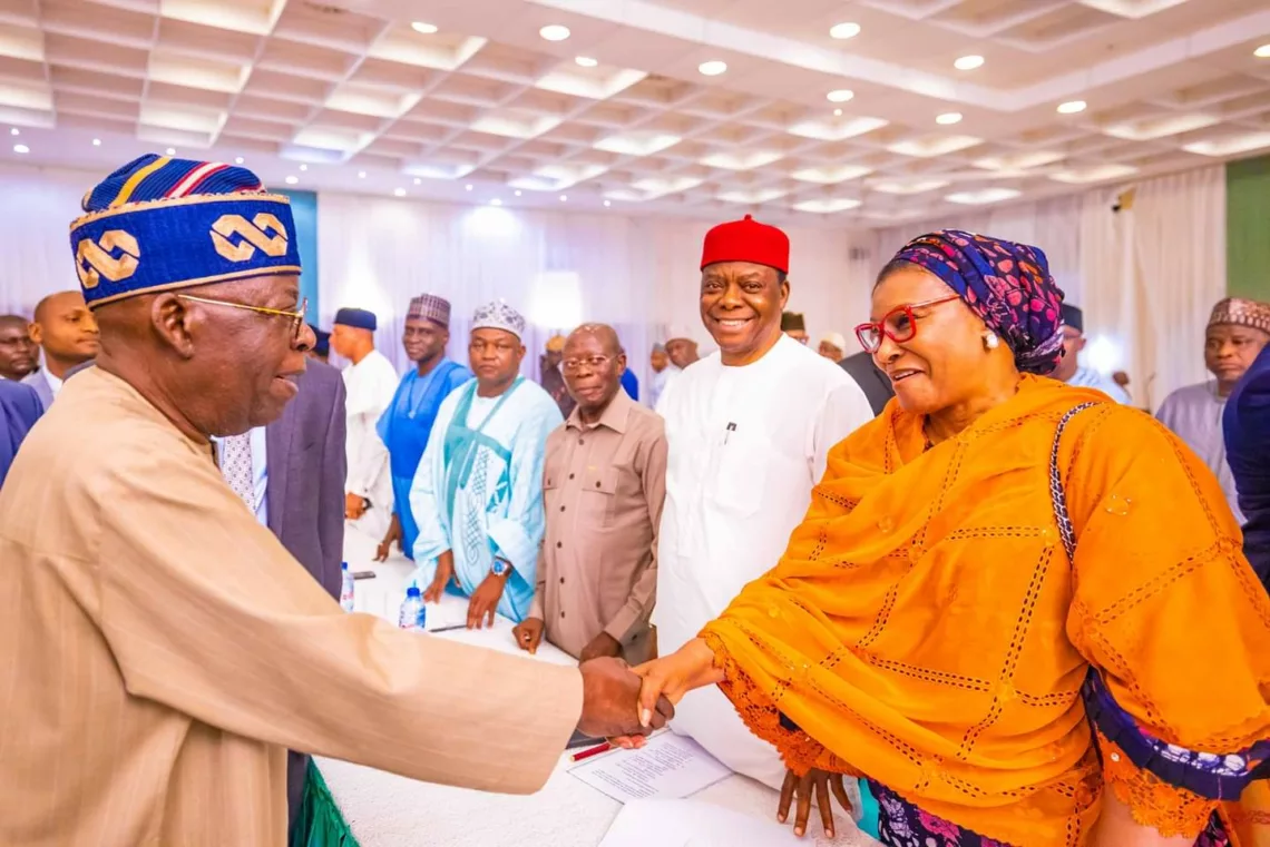 L-R: President Bola Tinubu exchanging pleasantries with a former chairman of LEADERSHIP Newspapers Group and now Senator-elect for FCT, Heebah Ireti Kingibe, during the President's meeting with all federal lawmakers-elect at the State House, Abuja, on Thursday.
