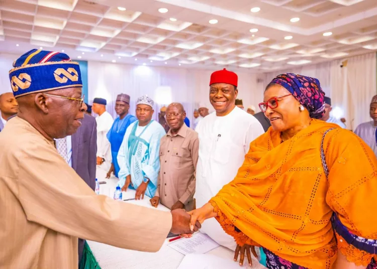 L-R: President Bola Tinubu exchanging pleasantries with a former chairman of LEADERSHIP Newspapers Group and now Senator-elect for FCT, Heebah Ireti Kingibe, during the President's meeting with all federal lawmakers-elect at the State House, Abuja, on Thursday.