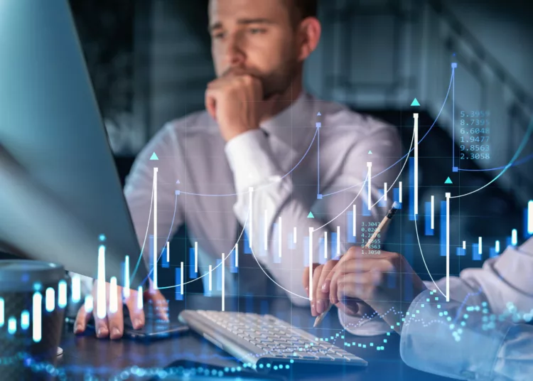 Two colleagues in formal wear working together to optimize trading strategy at corporate finance fund. Forex chart hologram over modern office background