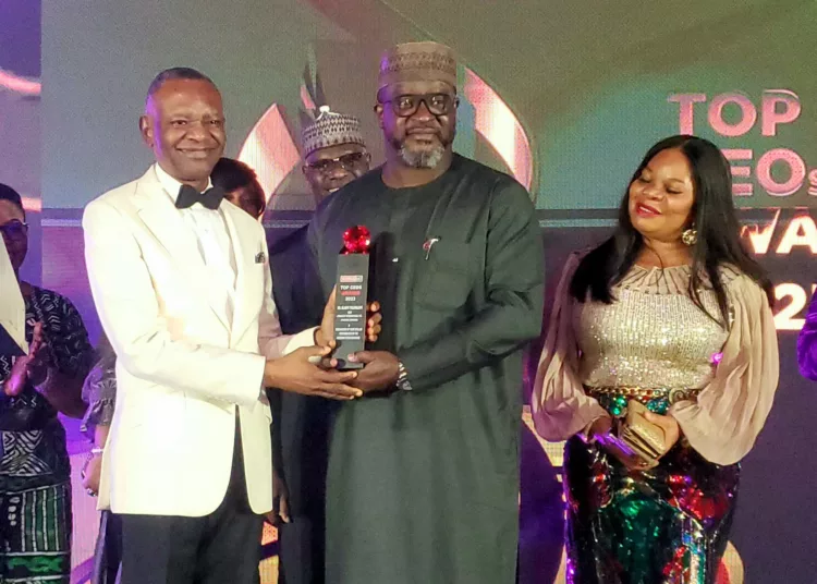 L-R: Publisher, BusinessDay Newspaper, Mr. Frank Aigbogun, presenting award to the managing director/chief executive officer, eTranzact Plc, Mr Olaniyi Toluwalope in recognition of the company’s stellar performance on the Nigerian Stock Exchange, along with  him, general council/group head, legal, eTranzact Plc, Eme Godwin, during the Business Day Top 25 CEOs Award in Lagos, recently