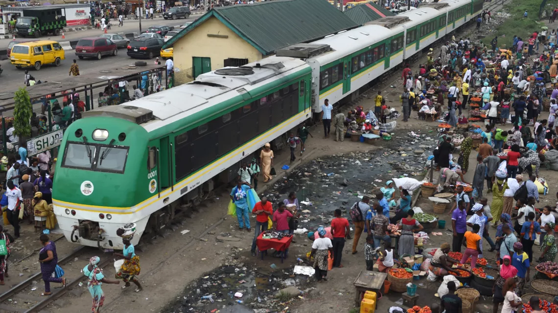 Passengers board a light rail train of Nigerian Railway