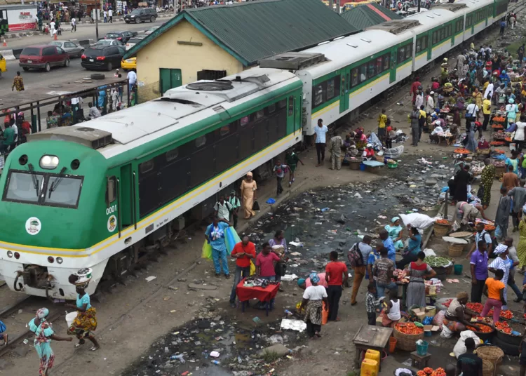 Passengers board a light rail train of Nigerian Railway