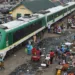 Passengers board a light rail train of Nigerian Railway