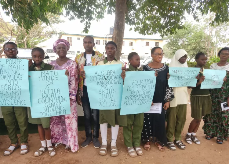 Convener, Real Life Mathematics, Mr. Joshua Ebeazor (4th from left) with the principal and students of Junior Secondary School, Abuja, during an event at the school, recently