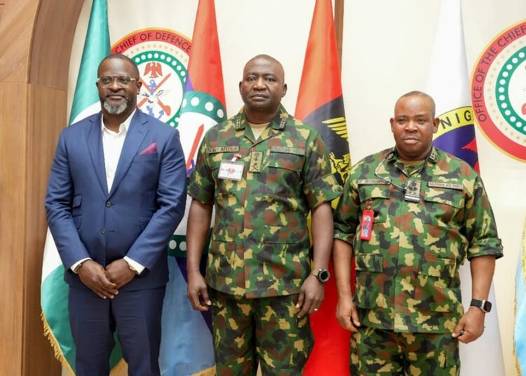 Chief of Defence Staff, General Christopher Musa, flanked by (from left) MD/CEO of eTranzact PLC, Mr. Niyi Toluwalope, and Chairman of the Military Pensions Board, Air Vice Marshal Paul Irumheson, during the stakeholder presentation to the Chief of Defense staff in Abuja